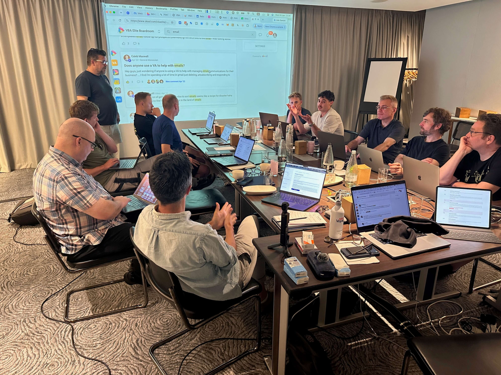 Video business owners working around a boardroom table